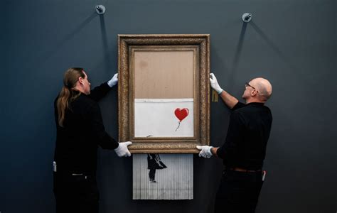 banksy painting shredded after auction